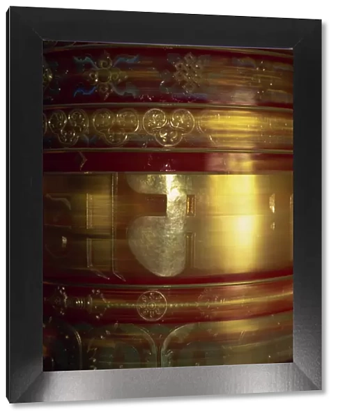 Large gold and red spinning Buddhist prayer wheels