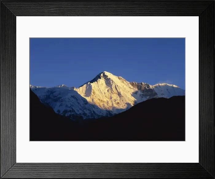 Framed Print : Sun on snow-capped high mountain peaks Framed Print : Sun on snow-capped high mountain peaks