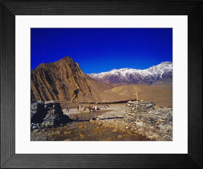 Framed Print : Nepalese man on a bridge crossing a stream in the Kangaki Framed Print : Nepalese man on a bridge crossing a stream in the Kangaki