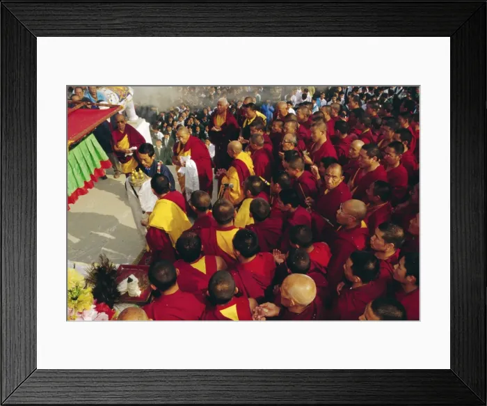 Framed Print : Buddhist monks giving offerings to the image of