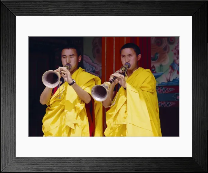 Framed Print : Monks blowing flutes outside a gompa (Tibetan monastery) Framed Print : Monks blowing flutes outside a gompa (Tibetan monastery)