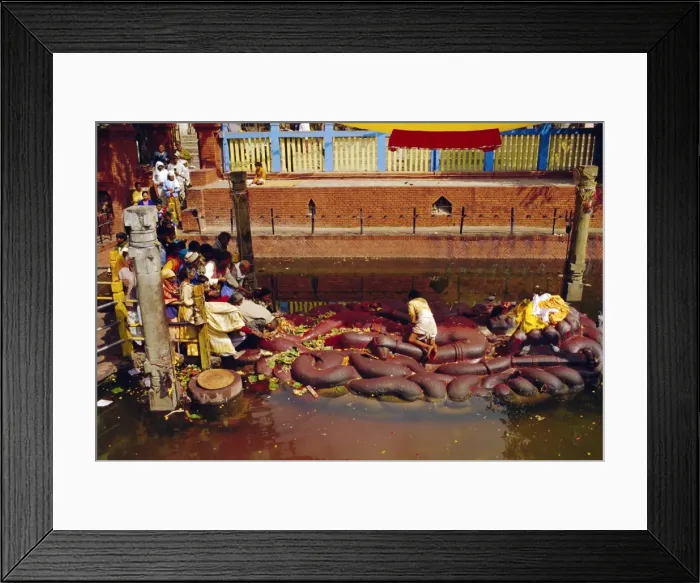 Framed Print : Hindus praying and giving offerings to a giant statue of Vishnu Framed Print : Hindus praying and giving offerings to a giant statue of Vishnu