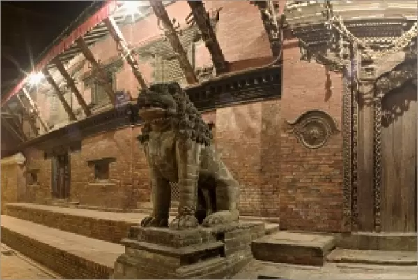 Two stone lions guard the entrance to Mul Chowk courtyard