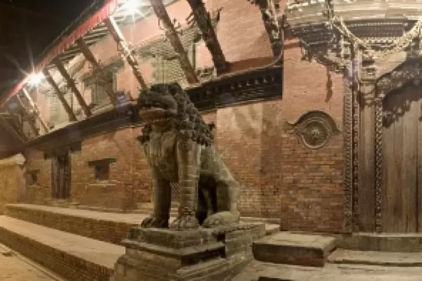Two stone lions guard the entrance to Mul Chowk courtyard