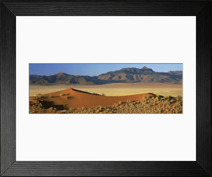 Framed Print : Panoramic view over orange sand dunes towards mountains Framed Print : Panoramic view over orange sand dunes towards mountains