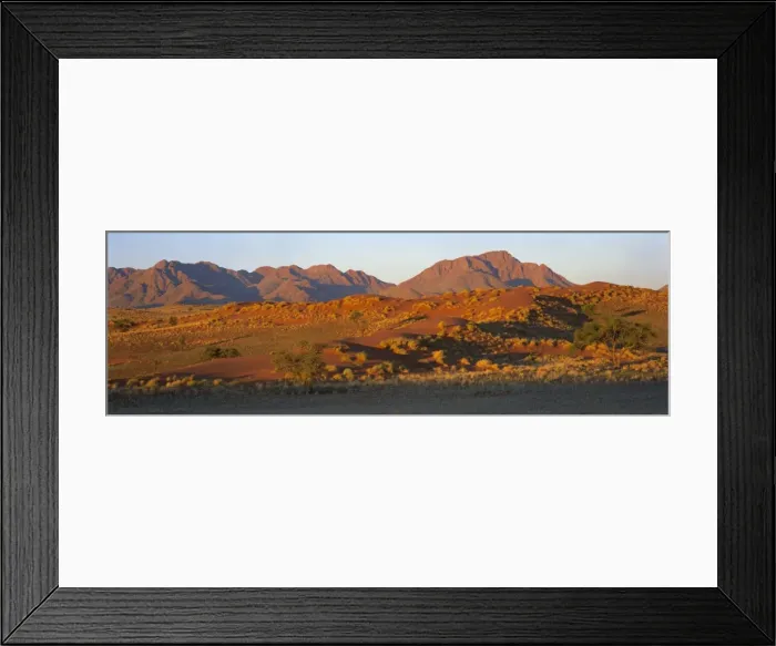 Framed Print : Panoramic view of mountains and dune glowing in last Framed Print : Panoramic view of mountains and dune glowing in last
