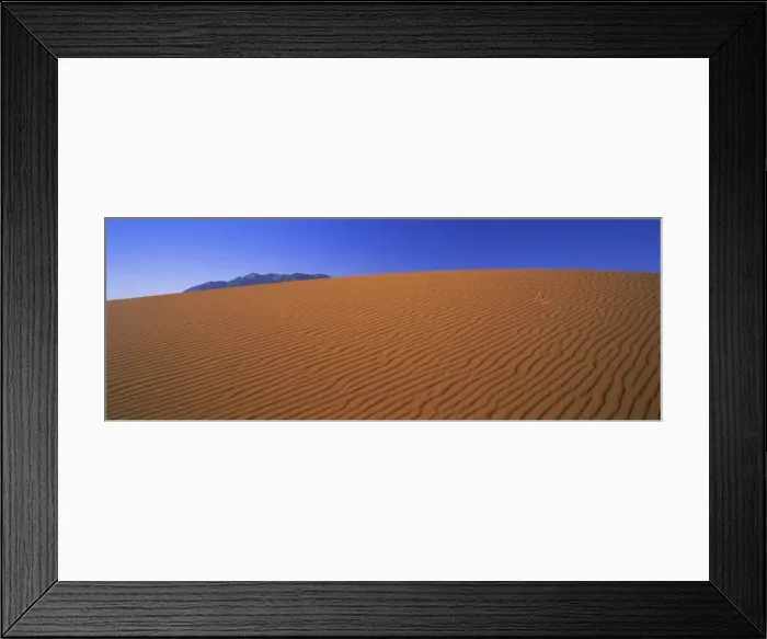 Framed Print : Panoramic view of orange sand dune and blue sky Framed Print : Panoramic view of orange sand dune and blue sky