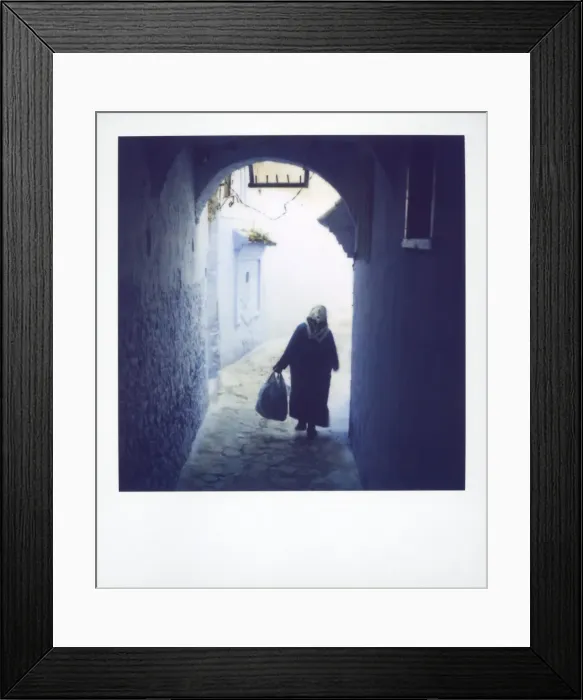 Framed Print : Woman in semi-silhouette walking through archway Framed Print : Woman in semi-silhouette walking through archway