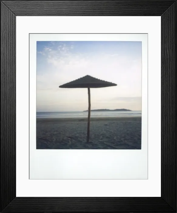 Framed Print : Polaroid image of brach parasol on deserted beach at dusk Framed Print : Polaroid image of brach parasol on deserted beach at dusk