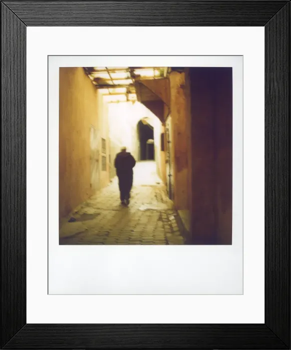 Framed Print : Polaroid image of man walking along narrow Framed Print : Polaroid image of man walking along narrow