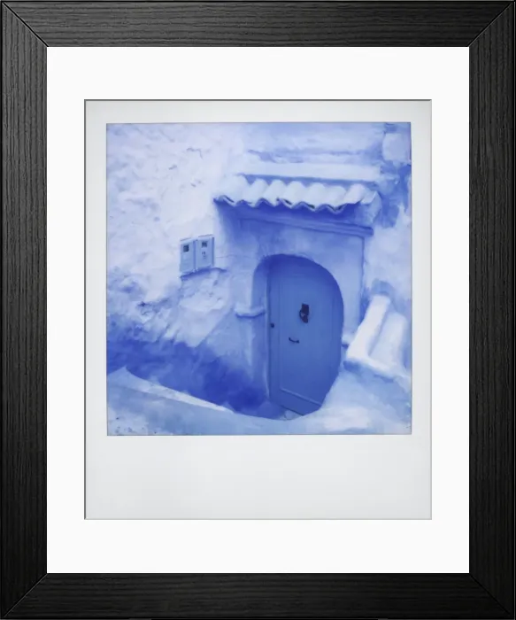 Framed Print : Polaroid of traditional painted blue door against bluewashed wall Framed Print : Polaroid of traditional painted blue door against bluewashed wall