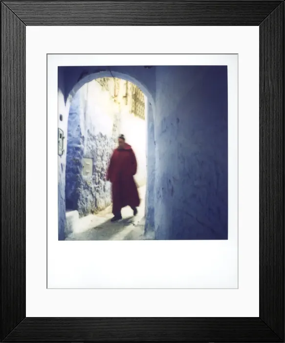 Framed Print : Polaroid of man wearing red djellaba walking through Framed Print : Polaroid of man wearing red djellaba walking through