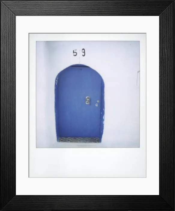 Framed Print : Polaroid of traditional painted blue door against whitewashed wall Framed Print : Polaroid of traditional painted blue door against whitewashed wall
