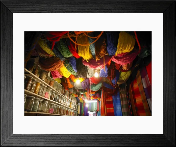 Framed Print : Brightly dyed wool hanging from roof of a shop Framed Print : Brightly dyed wool hanging from roof of a shop