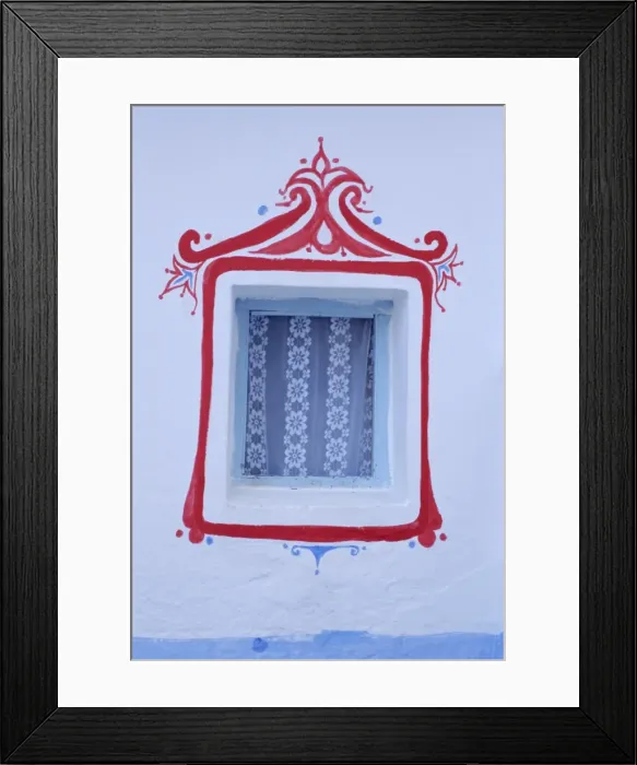 Framed Print : Decorated window in a white wall Framed Print : Decorated window in a white wall