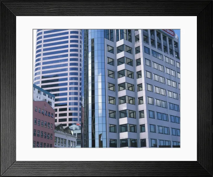 Framed Print : Close-up of modern buildings in the downtown area of Framed Print : Close-up of modern buildings in the downtown area of