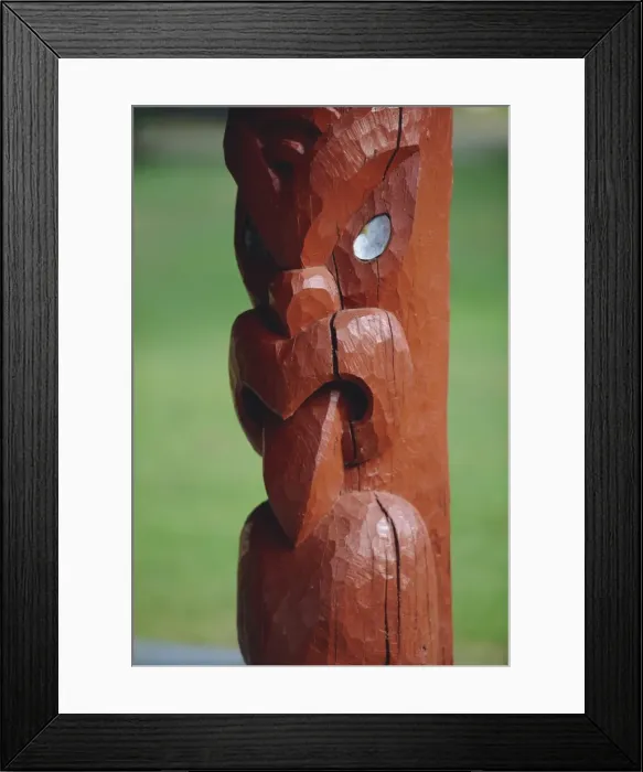 Framed Print : A carved figure or poupou in the replica village Framed Print : A carved figure or poupou in the replica village