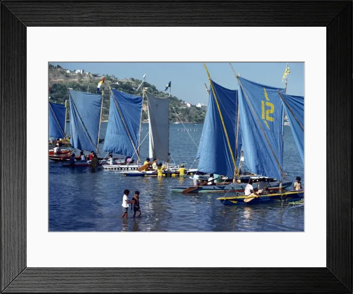 Framed Print : Boats with blue sails line up at the start of a Lakatoi canoe race Framed Print : Boats with blue sails line up at the start of a Lakatoi canoe race