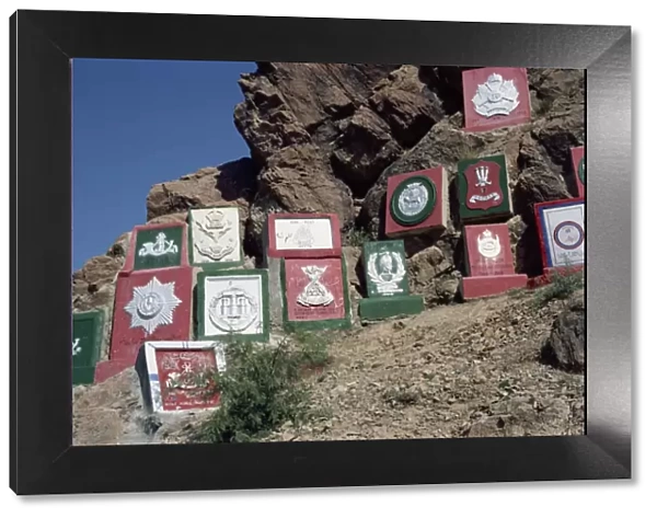 Regimental plaques on the mountain side in the Khyber Pass, N