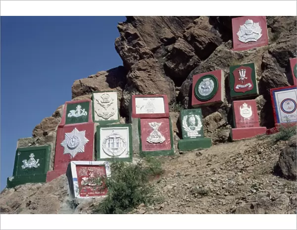Regimental plaques on the mountain side in the Khyber Pass, N