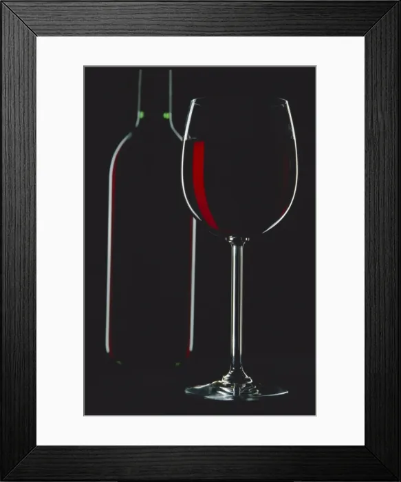 Framed Print : Studio shot of back-lit glass and bottle Framed Print : Studio shot of back-lit glass and bottle