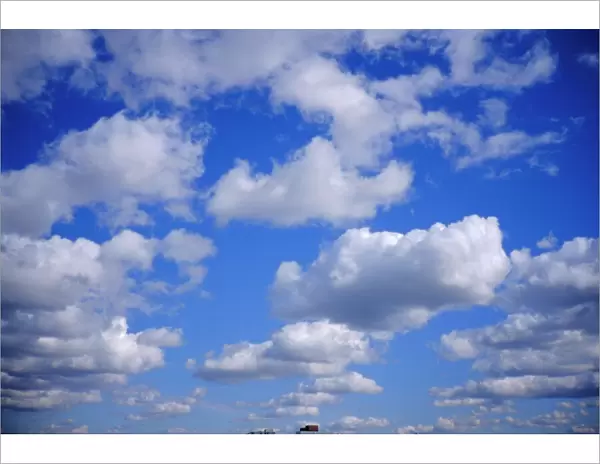 Blue sky and puffy white clouds