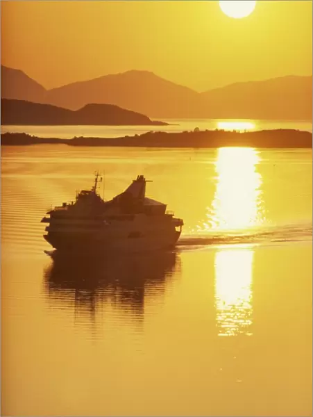 Ferry silhouetted by the midnight sun