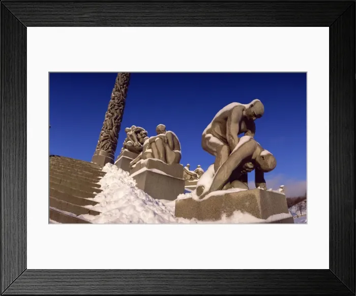 Framed Print : Snow covered statue in winter