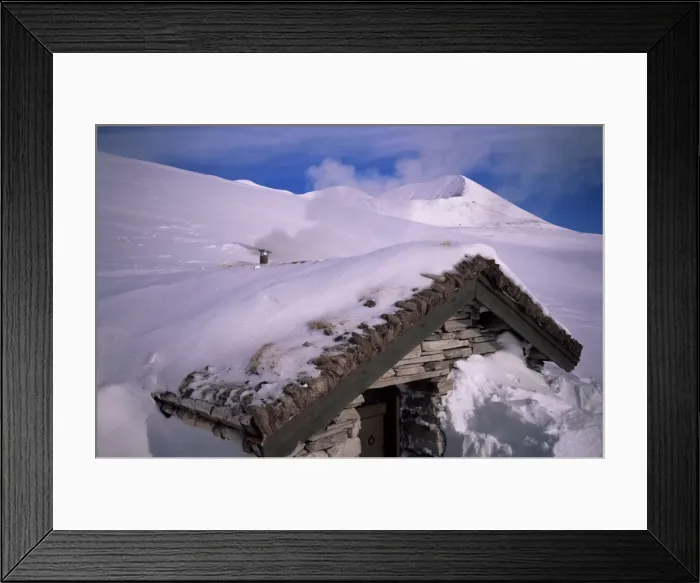Framed Print : Smoke from chimney as stove is fired up inside a buried stone hut Framed Print : Smoke from chimney as stove is fired up inside a buried stone hut