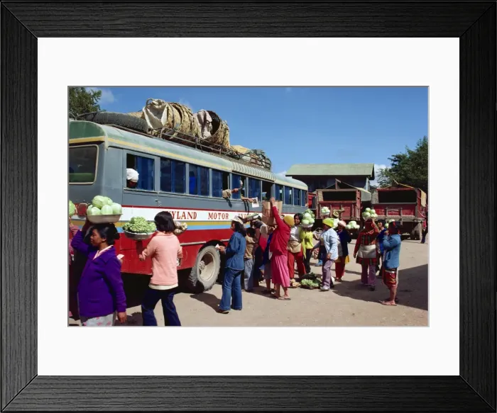 Framed Print : Groups of people loading vegetables and bags onto a Framed Print : Groups of people loading vegetables and bags onto a
