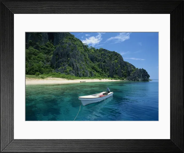Framed Print : Boat moored off a secluded beach on Coron Island Framed Print : Boat moored off a secluded beach on Coron Island