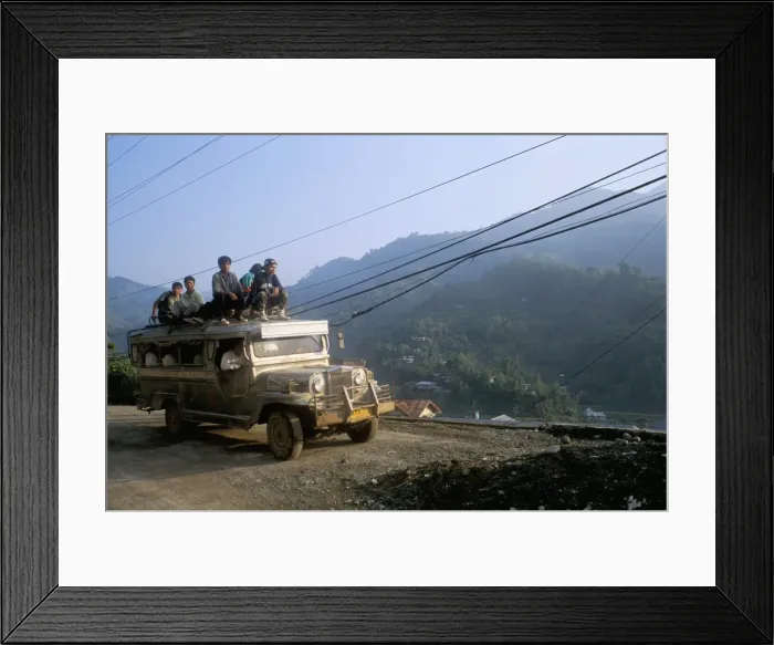 Framed Print : Truck carrying passengers on the roof