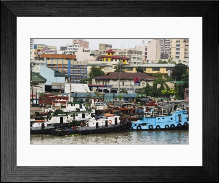 Framed Print : Barges on River Pasig with city buildings behind Framed Print : Barges on River Pasig with city buildings behind