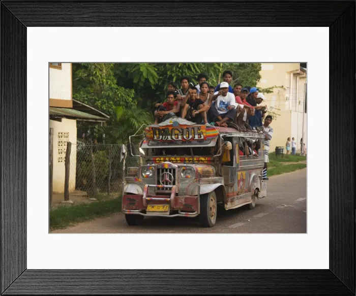 Framed Print : Jeepney truck with passengers crowded on roof Framed Print : Jeepney truck with passengers crowded on roof