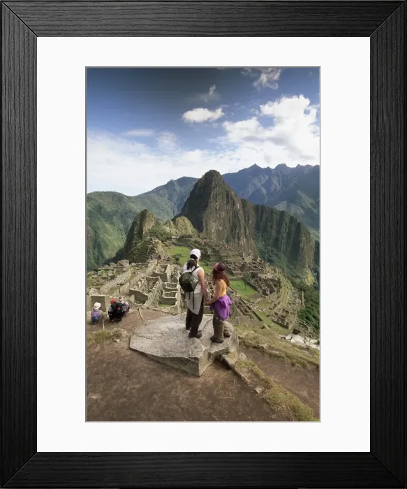 Framed Print : Tourists looking out over the ruins of the Inca site Framed Print : Tourists looking out over the ruins of the Inca site