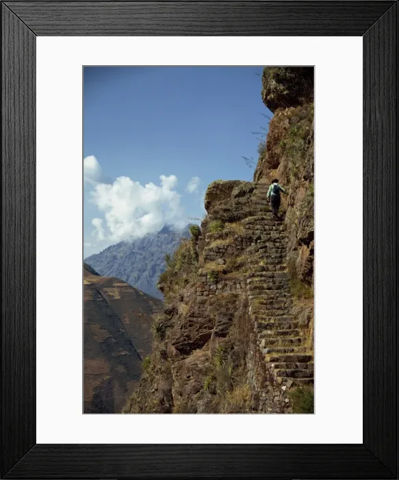 Framed Print : A walker climbs the steps on a narrow path along Framed Print : A walker climbs the steps on a narrow path along