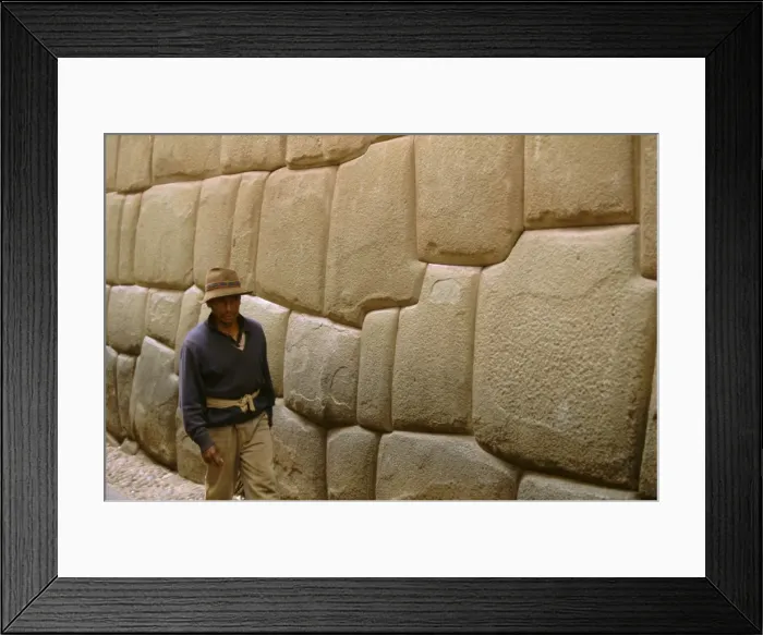 Framed Print : Man walking alongside Inca wall Framed Print : Man walking alongside Inca wall