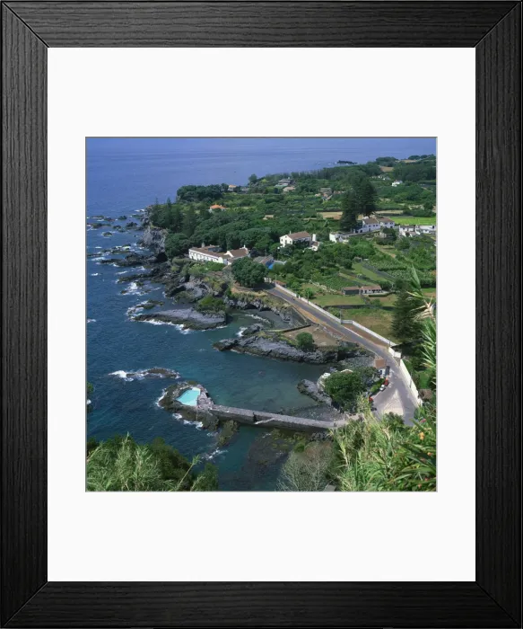Framed Print : Houses and rocky coastline in the south of the island