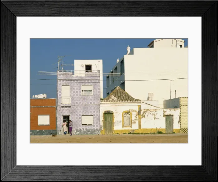 Framed Print : Women gossiping on the doorstep of a house on a street Framed Print : Women gossiping on the doorstep of a house on a street