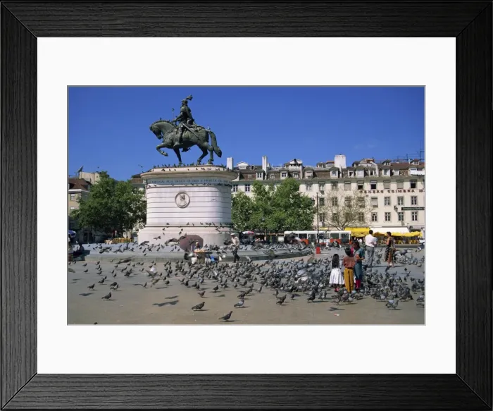 Framed Print : Children feed pigeons in Figueira Square in Lisbon Framed Print : Children feed pigeons in Figueira Square in Lisbon