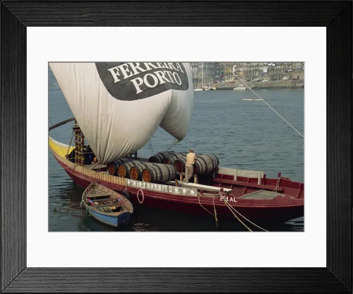 Framed Print : Casks of port on a barge on the Douro River in Porto Framed Print : Casks of port on a barge on the Douro River in Porto