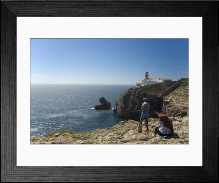 Framed Print : A man fishes from the tall cliffs of Cabo de Sao Vicente
