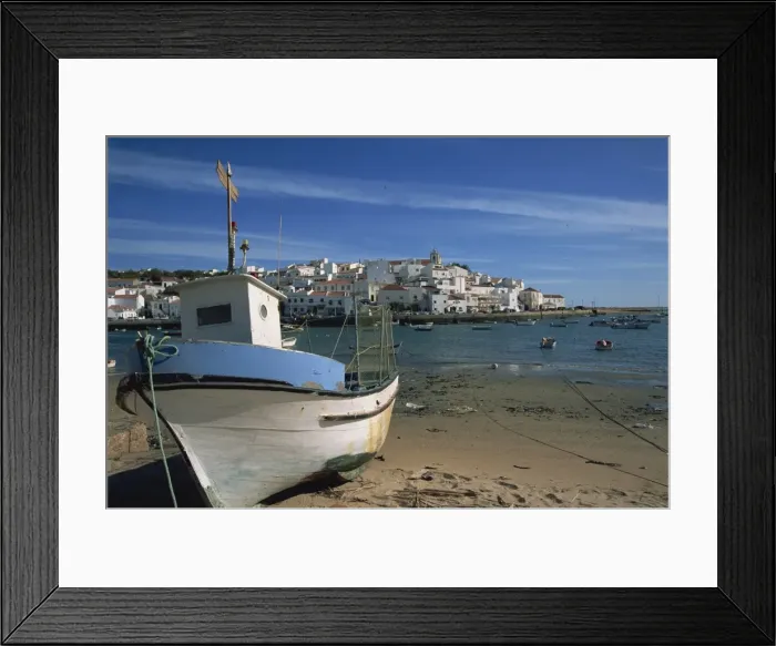 Framed Print : Fishing boat on the beach in small fishing village near Portimao Framed Print : Fishing boat on the beach in small fishing village near Portimao