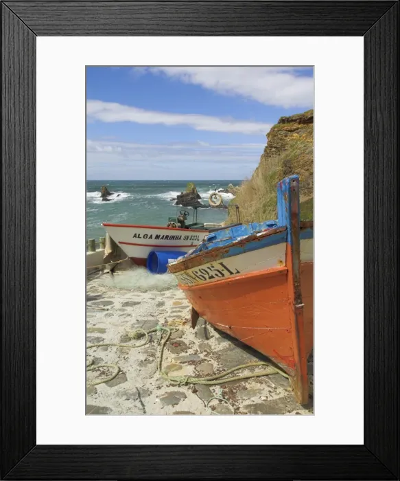 Framed Print : Traditional Portuguese fishing boats in a small coastal harbour Framed Print : Traditional Portuguese fishing boats in a small coastal harbour