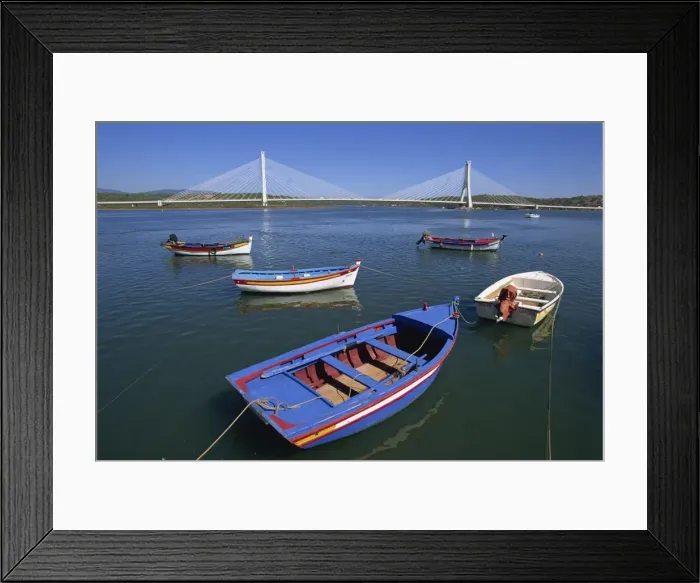 Framed Print : Tranquil scene of fishing boats and suspension bridge Framed Print : Tranquil scene of fishing boats and suspension bridge