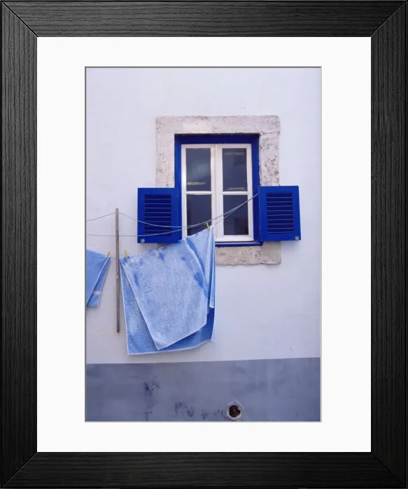 Framed Print : Laundry hanging on line at window in the Moorish quarter of Alfama Framed Print : Laundry hanging on line at window in the Moorish quarter of Alfama