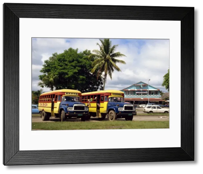 Framed Print : Local buses on a street in Apia Framed Print : Local buses on a street in Apia