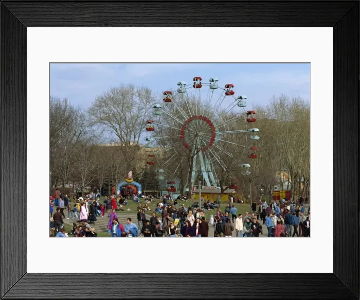 Framed Print : Crowds at a funfair with a big wheel during Earth Day Framed Print : Crowds at a funfair with a big wheel during Earth Day