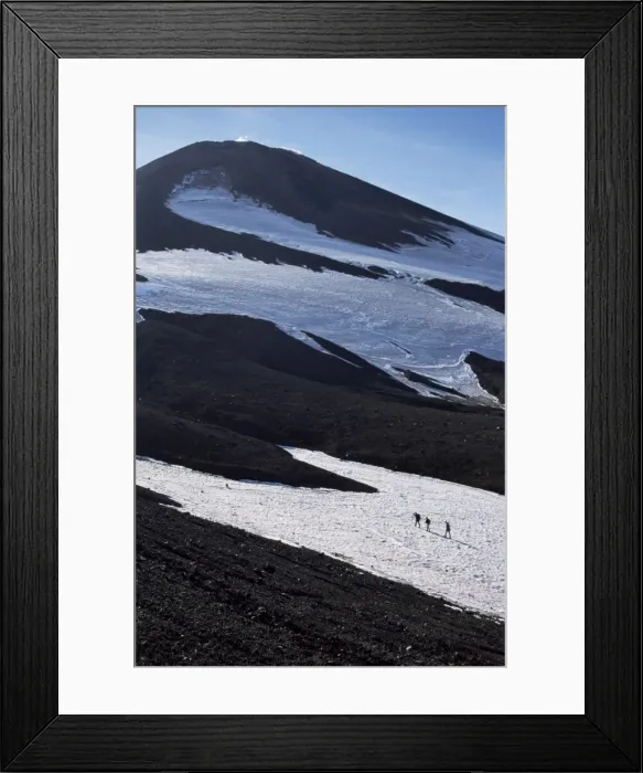 Framed Print : Walkers on snow field below steaming summit cone Framed Print : Walkers on snow field below steaming summit cone