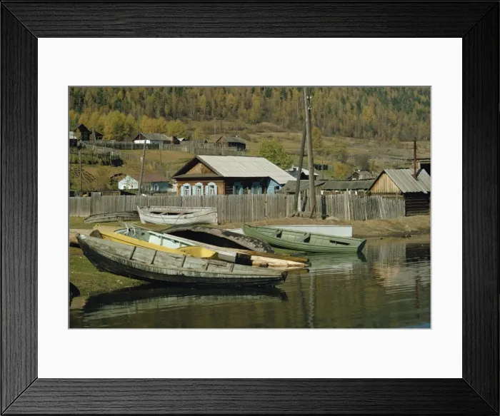 Framed Print : Boats pulled out of water and wooden houses Framed Print : Boats pulled out of water and wooden houses